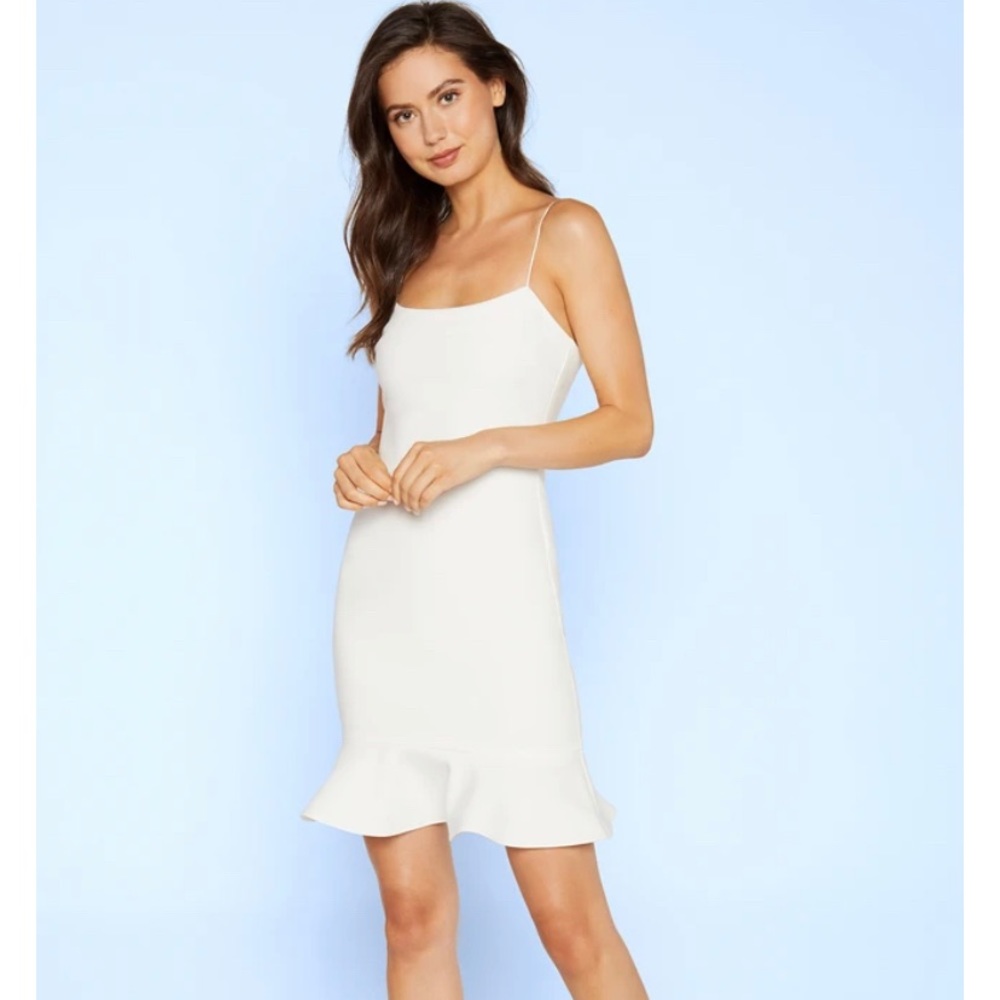 Likely white strappy dress